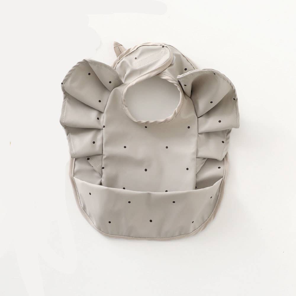 Waterproof grey ruffled bib with polka dots