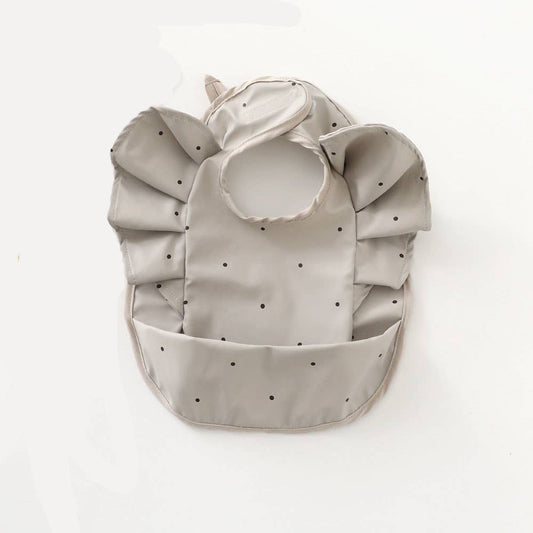 Waterproof grey ruffled bib with polka dots