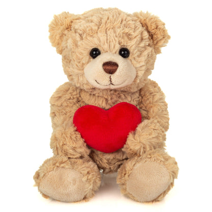 Beige teddy bear with a heart