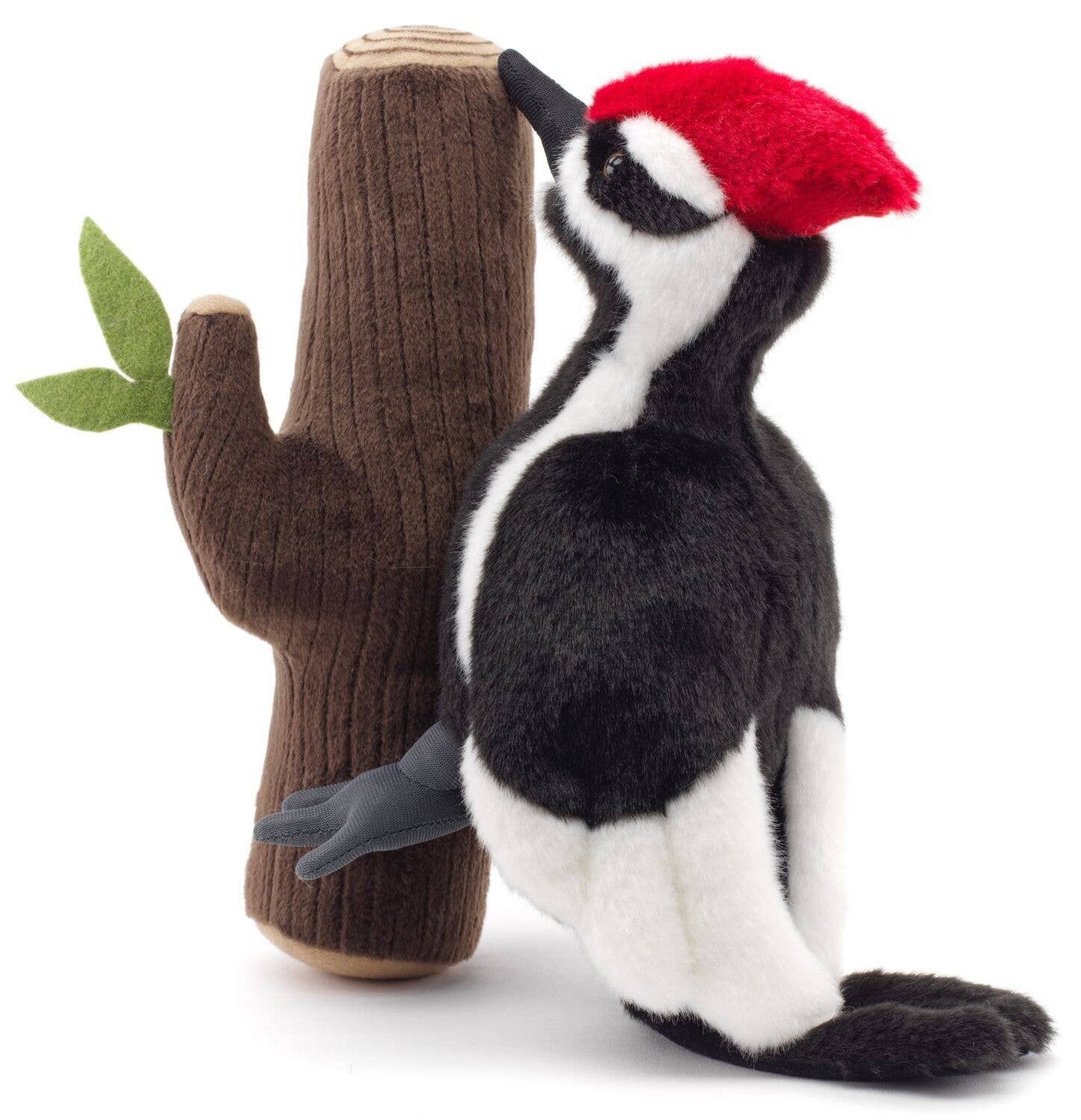Woodpecker plush toy on the trunk