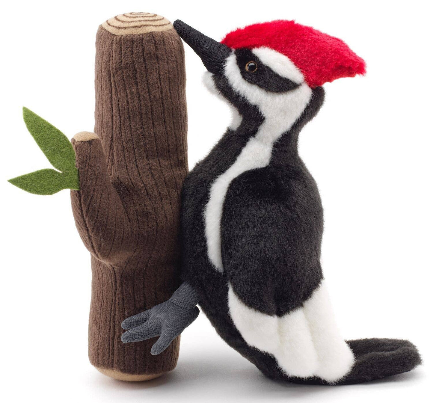 Woodpecker plush toy on the trunk