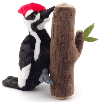 Woodpecker plush toy on the trunk